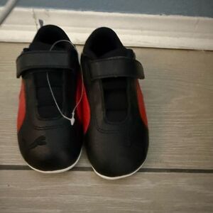 Brand new Puma Kids Black and Red Sneakers
